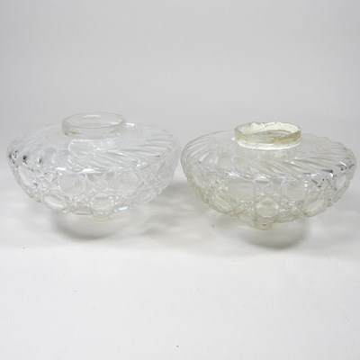 Lot 89 - A pair of glass oil lamp fonts
