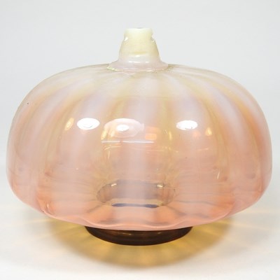 Lot 34 - A peach glass oil lamp font