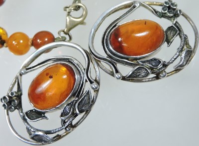 Lot 56 - An amber necklace and earrings