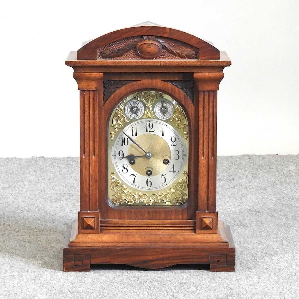 Lot 225 An Edwardian walnut mantel clock