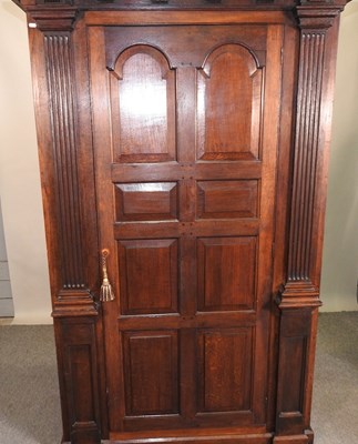 Lot 402 - An oak hall cupboard