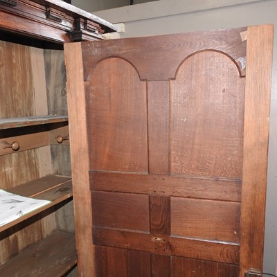 Lot 402 - An oak hall cupboard