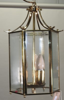 Lot 100 - A brass chandelier