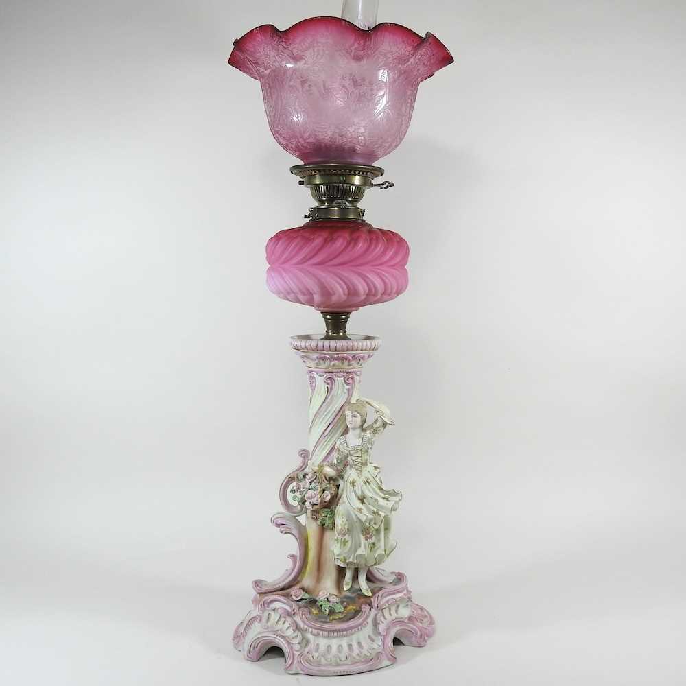 Lot 29 - A 19th century continental figural oil lamp