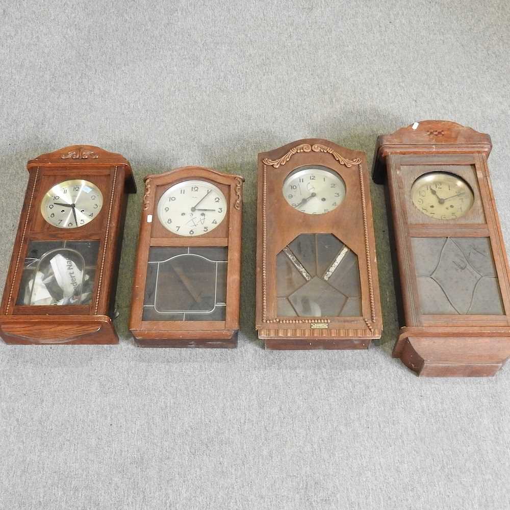 Lot 457 - A collection of four wall clocks