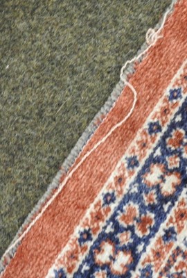 Lot 186 - A small silk rug