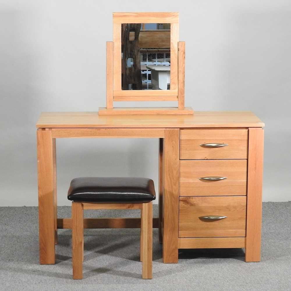 Lot 410 - A light oak dressing table