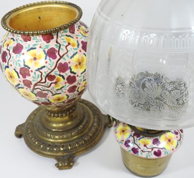 Lot 145 - A painted and brass oil lamp