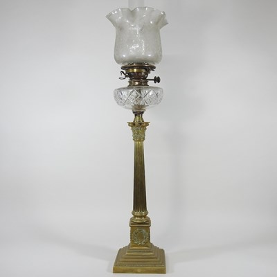 Lot 90 - A brass column oil lamp