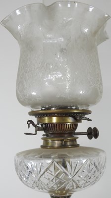 Lot 90 - A brass column oil lamp