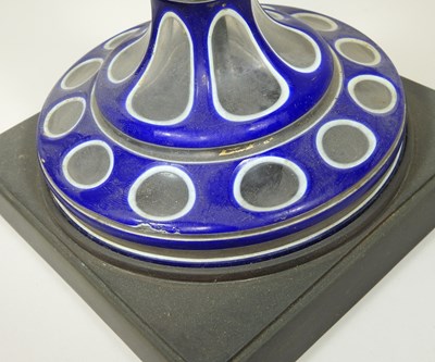Lot 22 - A Bohemian overlaid blue glass oil lamp base